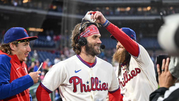 Sep 23, 2023; Philadelphia, Pennsylvania, USA; Philadelphia Phillies center fielder Brandon Marsh and second baseman Bryson Stott harass designated hitter Bryce Harper during a post game interview after the game against the New York Mets at Citizens Bank Park. Philadelphia won 7-5. Mandatory Credit: John Geliebter-USA TODAY Sports